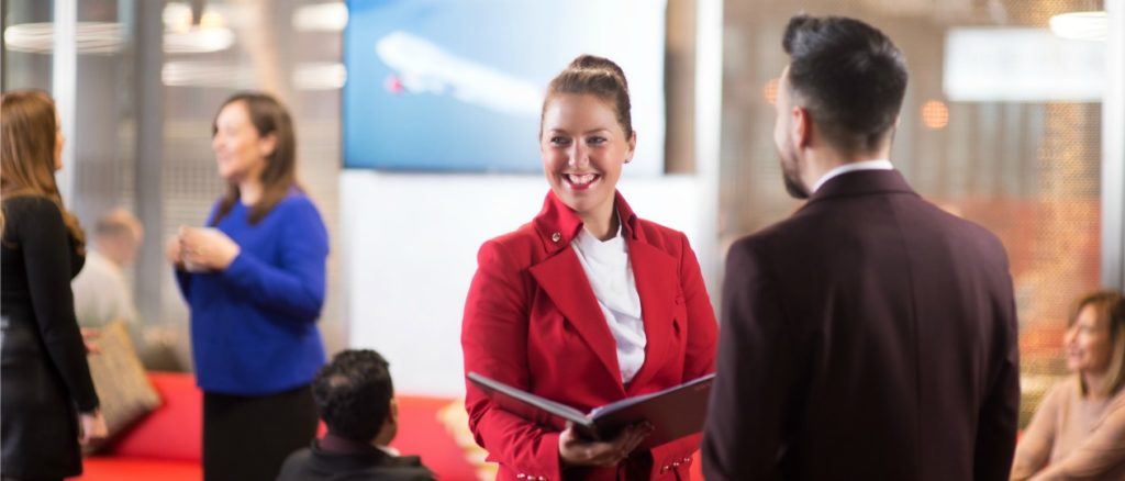 Virgin Atlantic in uniform employee talking