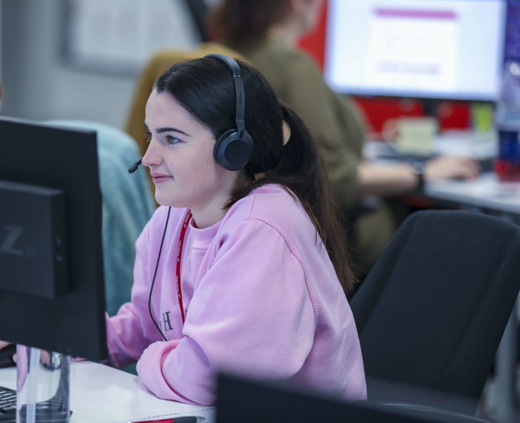 Customer Centre employee looking at computer screen