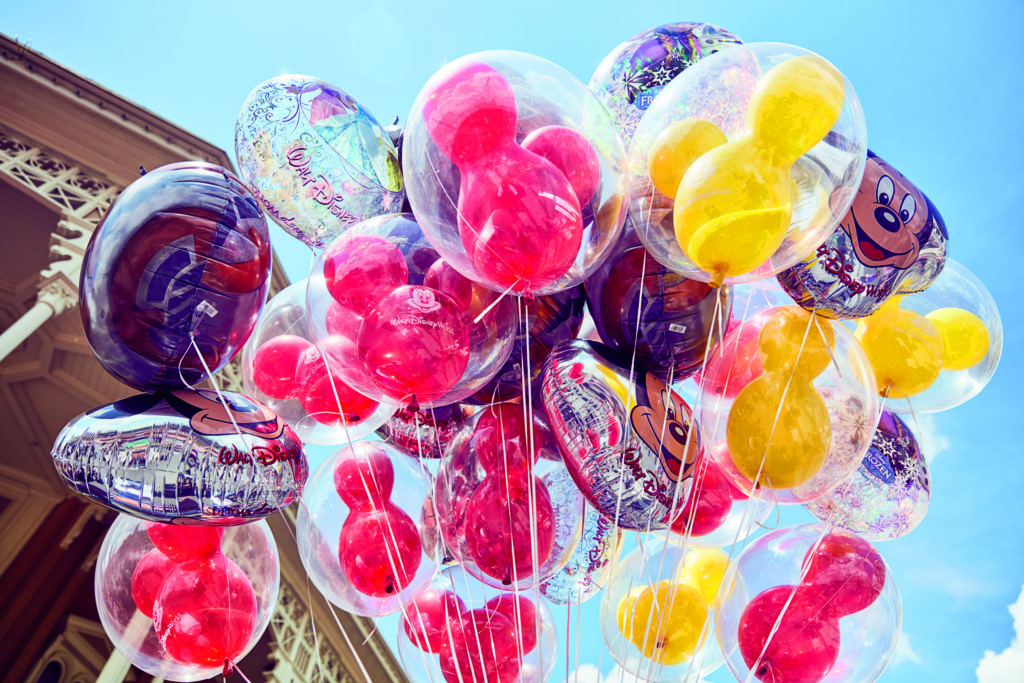 Balloons with Micky mouse ears in them.