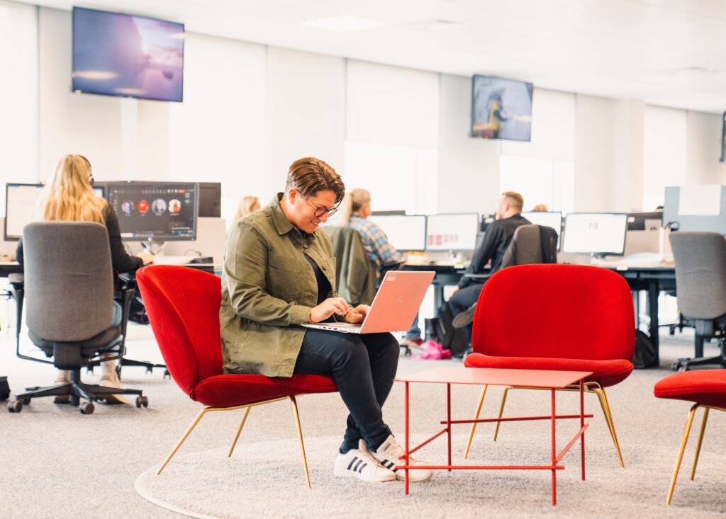 Virgin Atlantic employee at the head office working on their laptop