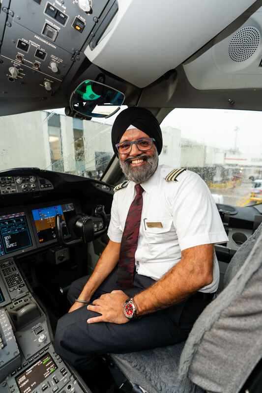 A Virgin Atlantic cockpit featuring a man in a turban