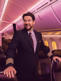 Virgin Atlantic Pilot smiling onboard an aircraft