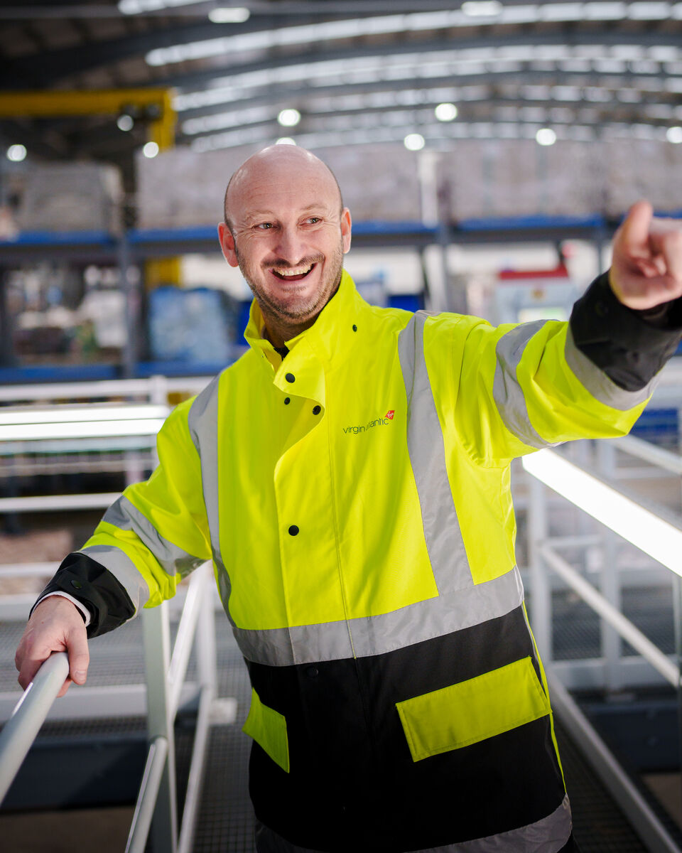 Virgin Atlantic team member loading cargo at the airport