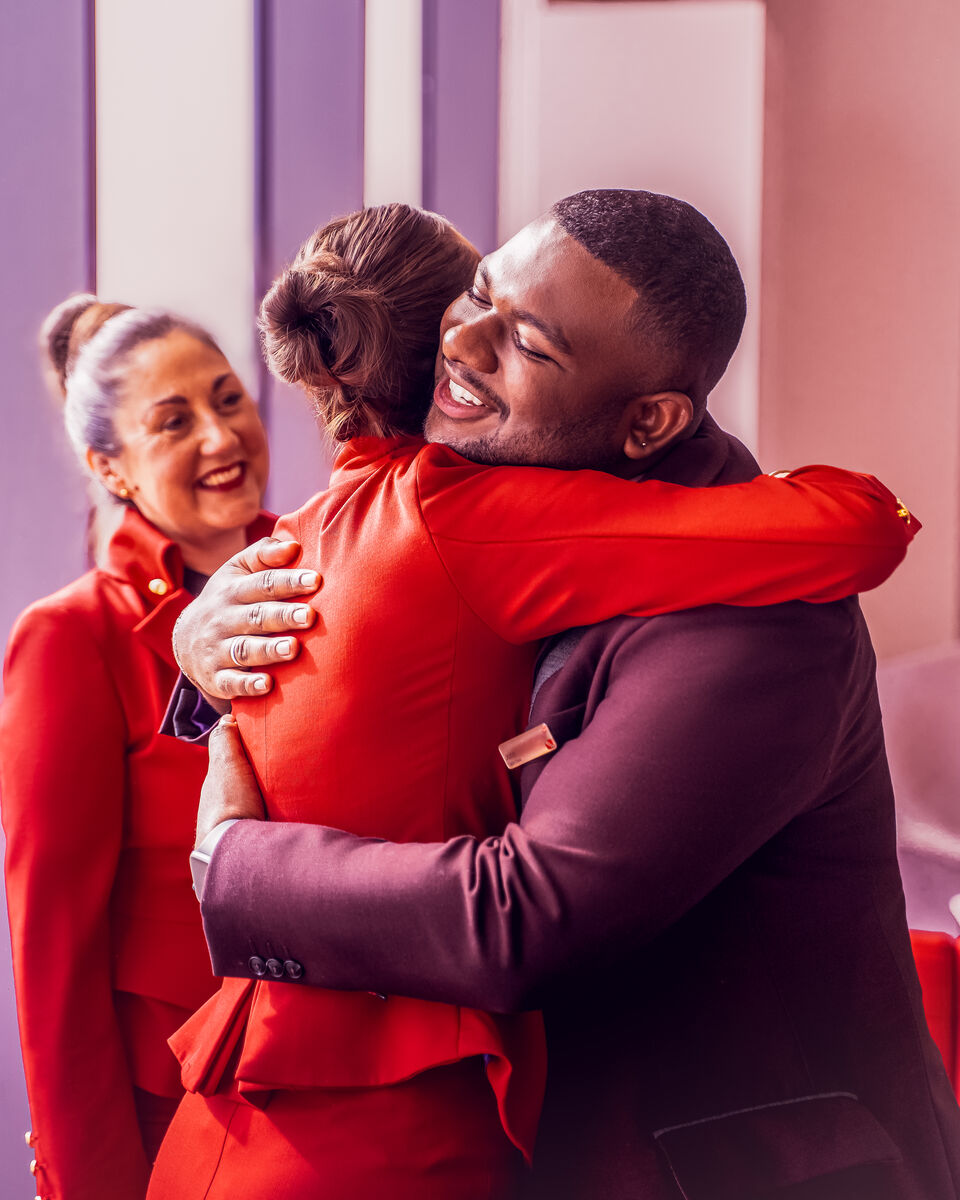 Virgin Atlantic colleagues hugging each other